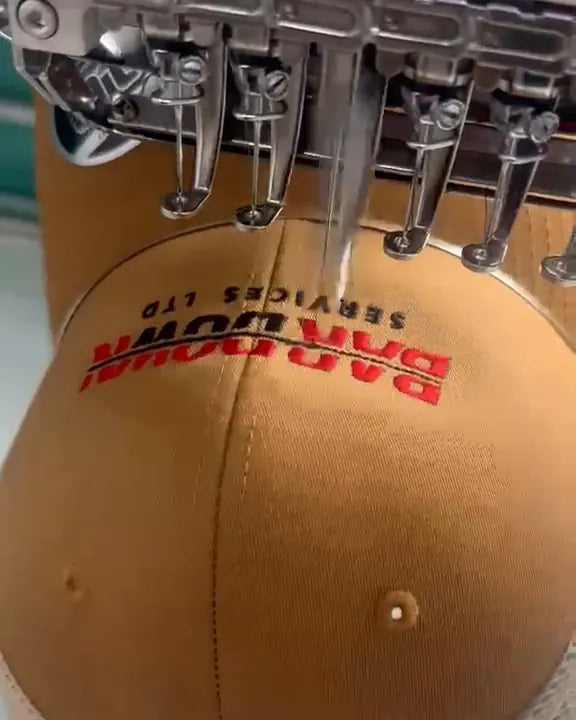 Hat being embroidered on one of our machines